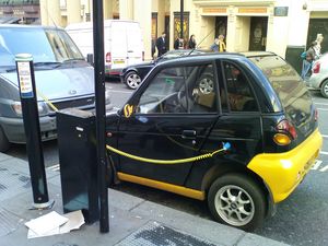 Electric car in London charging small.JPG